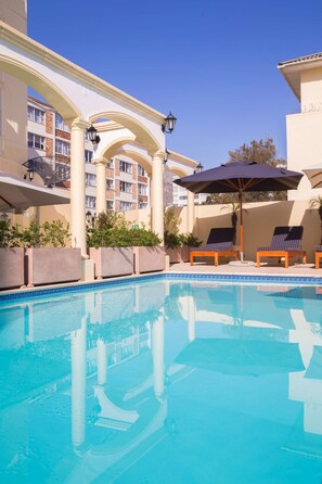 Outdoor pool, pool umbrellas, sun loungers