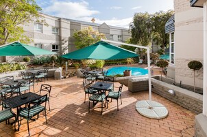 Outdoor pool, open 7:00 AM to 7:00 PM, pool umbrellas, sun loungers