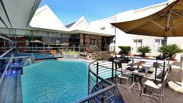 Outdoor pool, open 6 AM to 9 PM, pool umbrellas, sun loungers