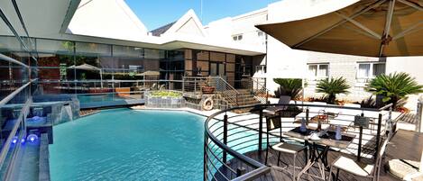 Outdoor pool, open 6 AM to 9 PM, pool umbrellas, pool loungers