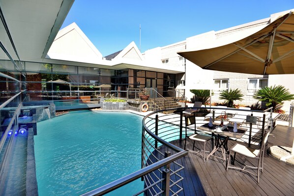 Outdoor pool, open 6 AM to 9 PM, pool umbrellas, pool loungers