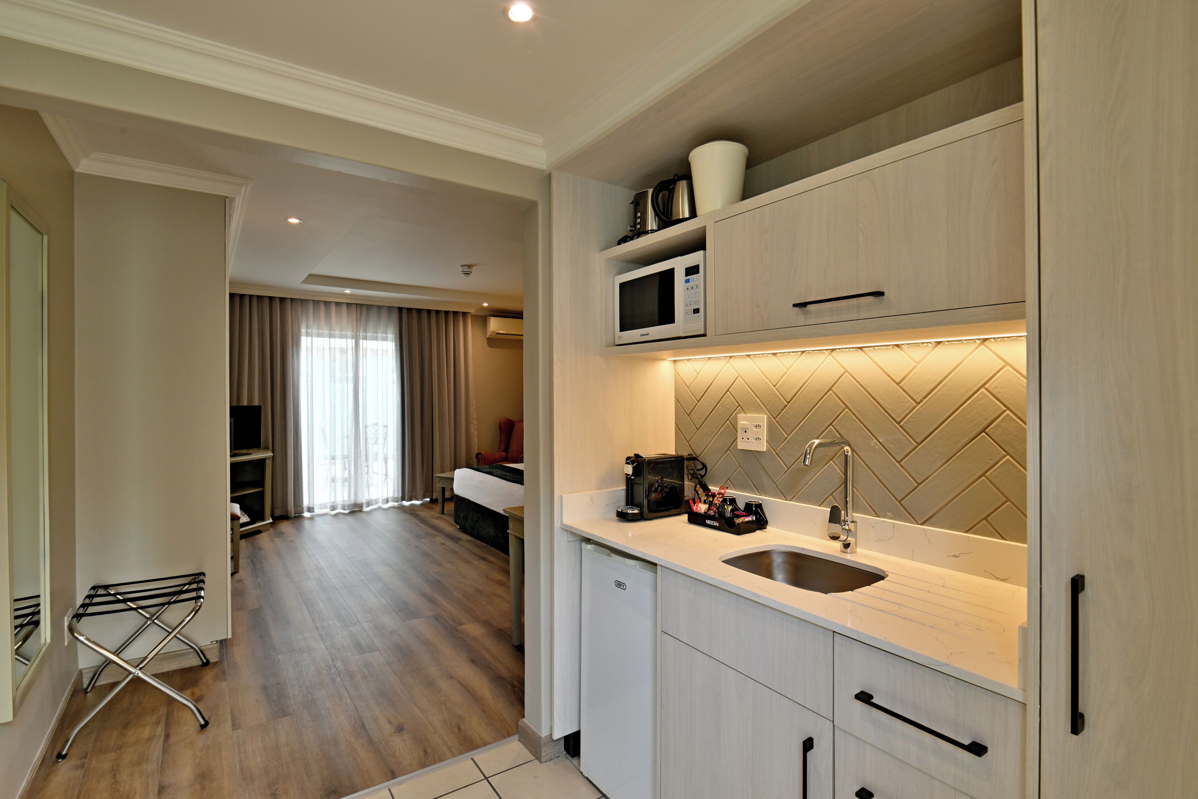 Fridge, microwave, electric kettle, cookware/dishes/utensils