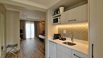 Fridge, microwave, electric kettle, cookware/dishes/utensils