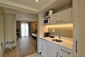 Fridge, microwave, electric kettle, cookware/dishes/utensils