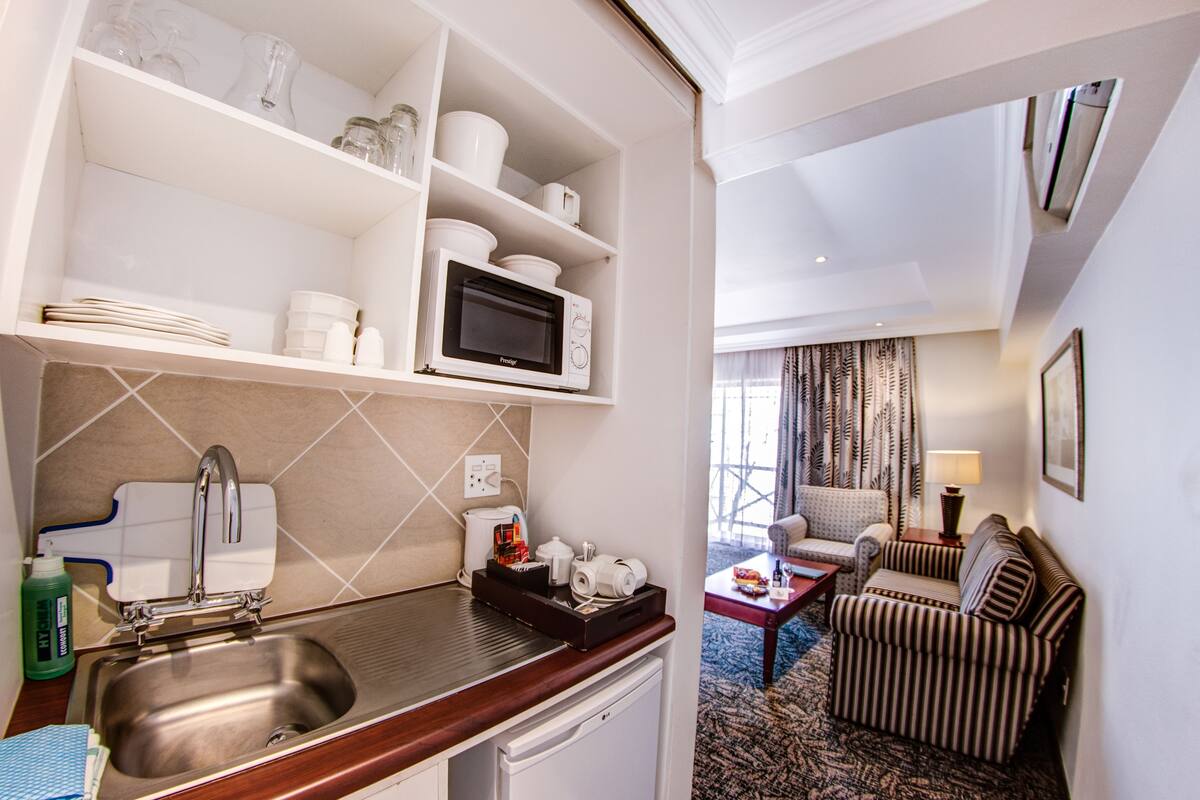 fridge, microwave, electric kettle, cookware/dishes/utensils