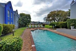 Outdoor pool, open 10:00 AM to 8:00 PM, pool umbrellas, pool loungers