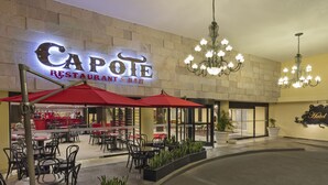 A restaurant named Capote with outdoor seating and a chandelier. - Francia Aguascalientes (Aguascalientes)