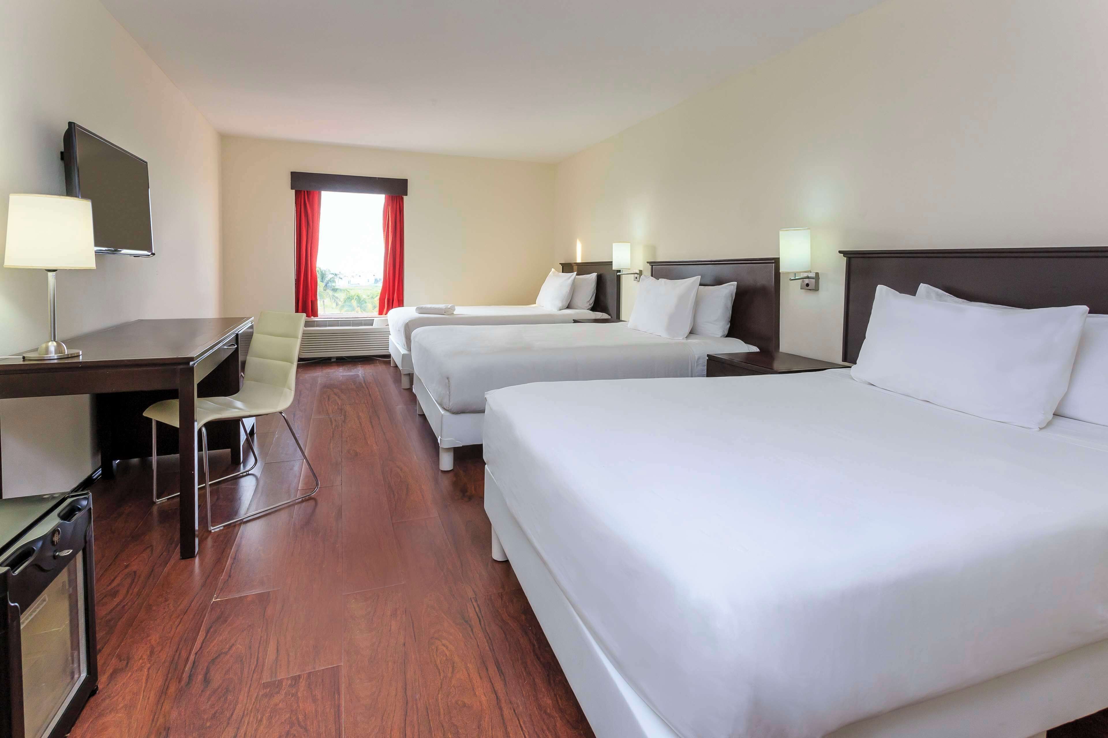 Premium bedding, down comforters, minibar, in-room safe