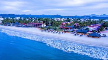 On the beach, sun loungers, beach towels, 2 beach bars