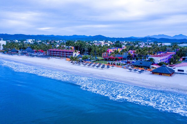 On the beach, sun-loungers, beach towels, 2 beach bars