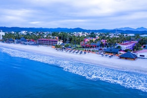 On the beach, sun loungers, beach towels, 2 beach bars