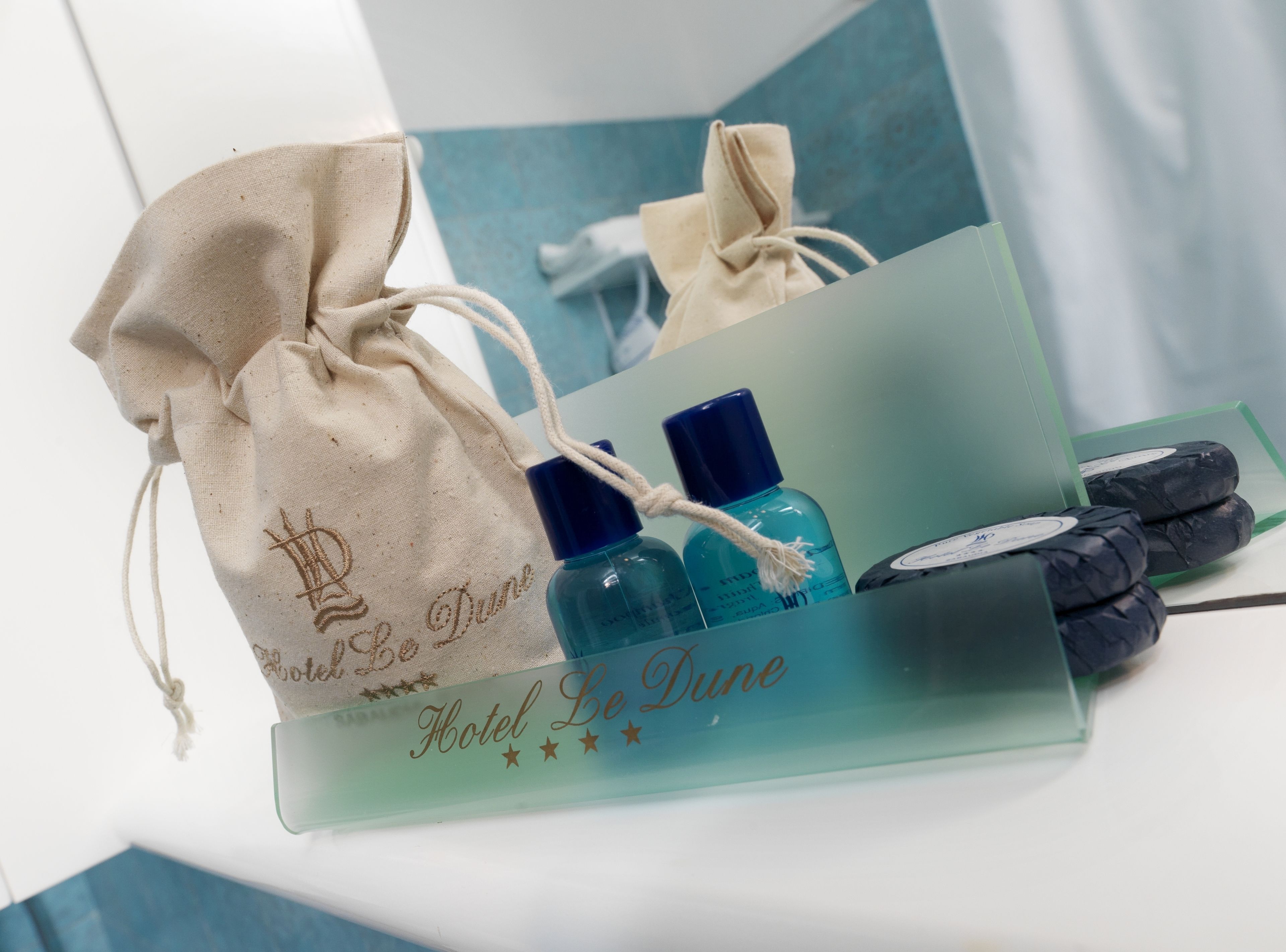A hotel gift set with a drawstring bag and toiletries.
