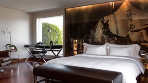 A modern bedroom with a large bed, a desk, and a chair. - The Hotel Luzern, Autograph Collection (Lucerne)