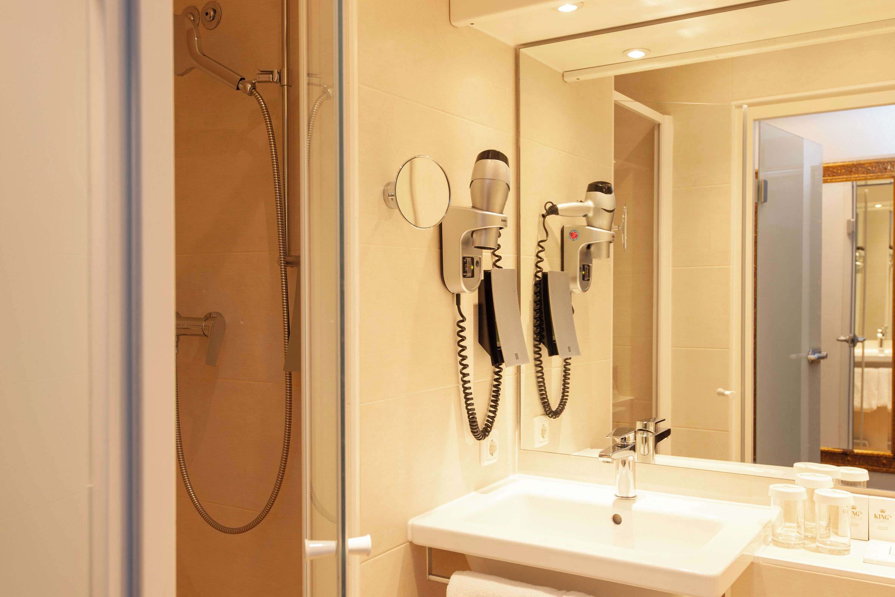 superior family room | bathroom | shower, hair dryer, towels, soap