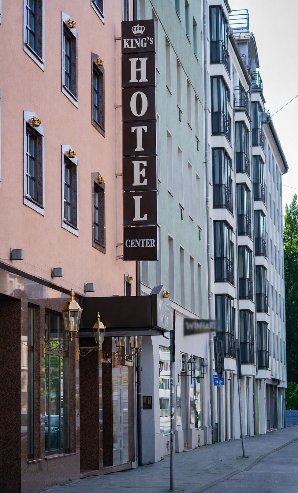 A hotel building with a prominent sign reading 'KING'S HOTEL CENTER'.