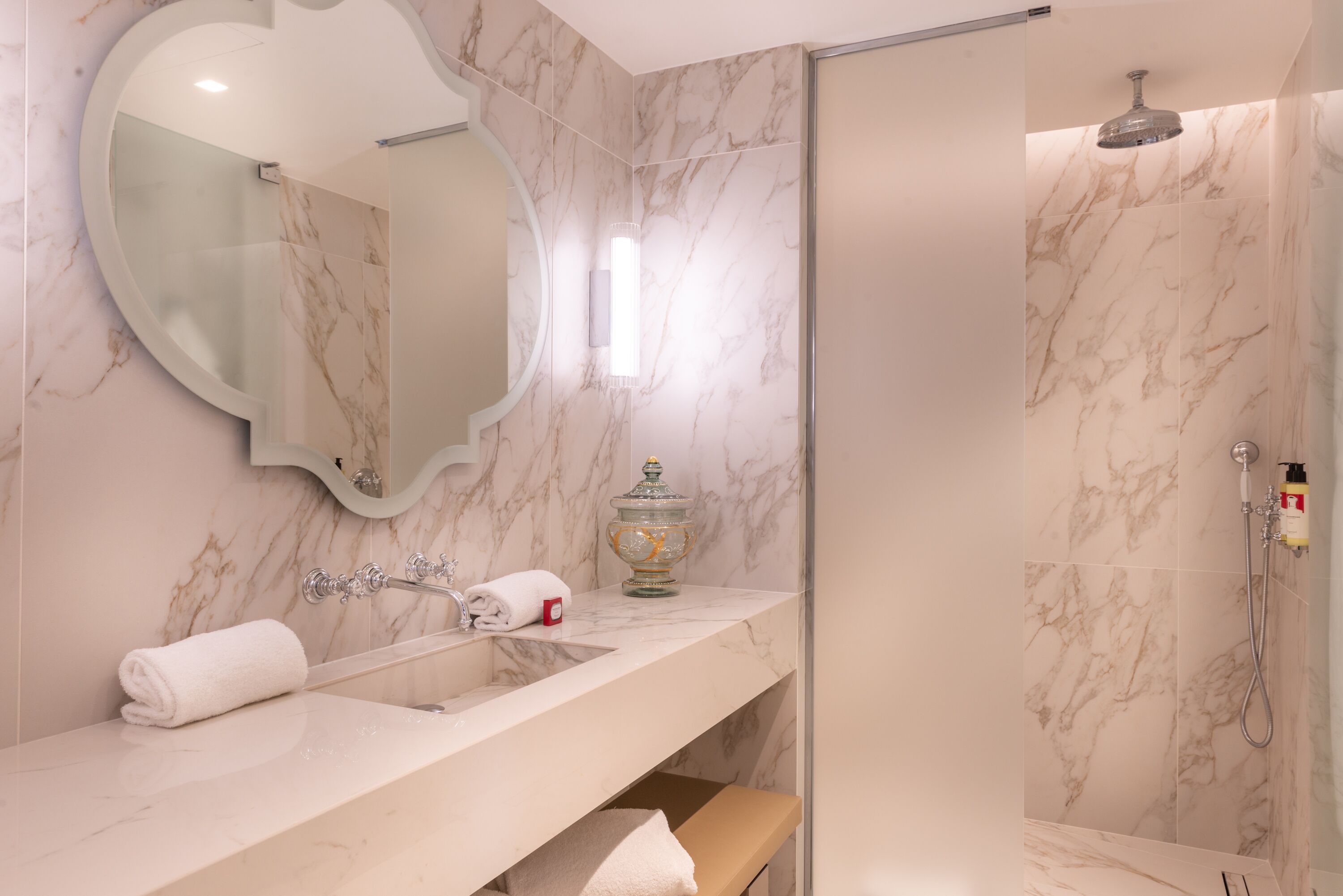deluxe suite | bathroom | designer toiletries, hair dryer, bathrobes, slippers