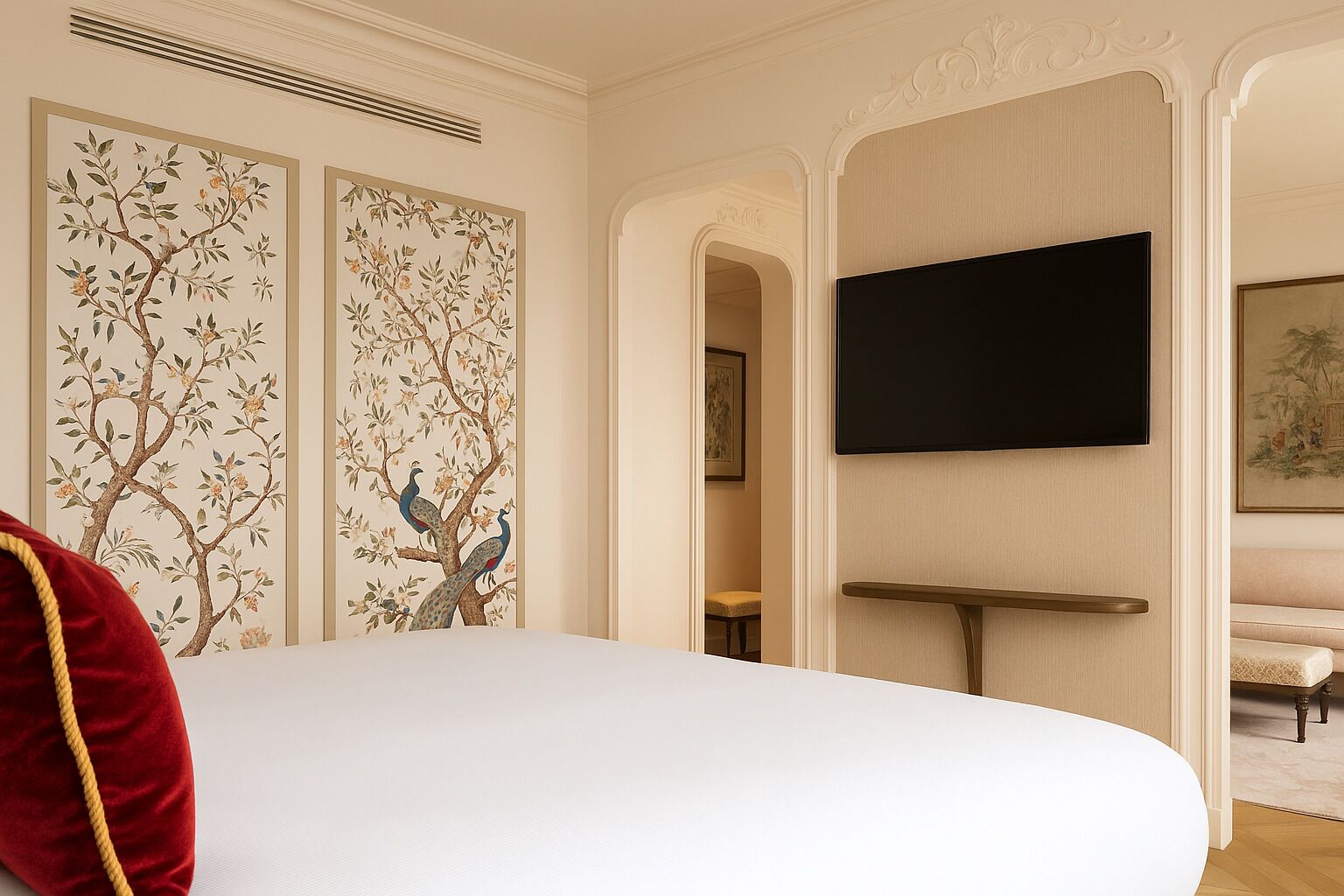 A hotel room with a large bed, a flat-screen TV mounted on the wall, and decorative wall panels.