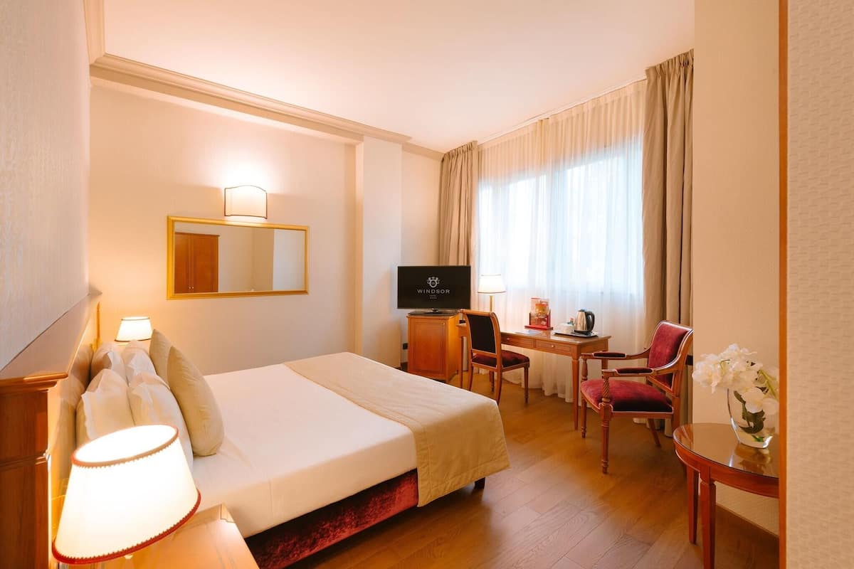 Hypo-allergenic bedding, free minibar, in-room safe, desk