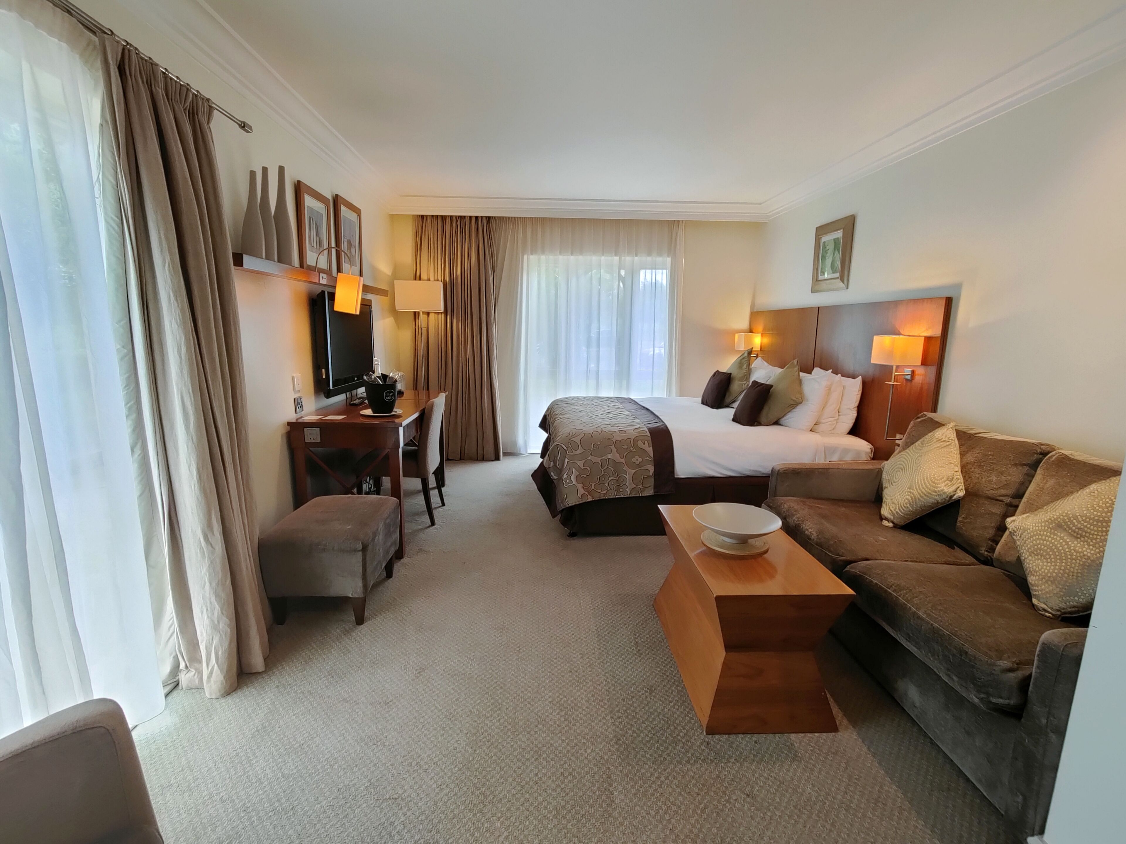 deluxe double room, main house | in-room safe, individually decorated, desk, laptop workspace