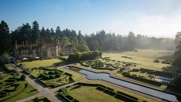 A large estate with a formal garden, a central water feature, and a grand building. - Rhinefield House Hotel (Brockenhurst)