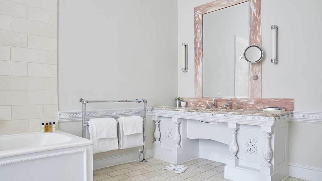 junior suite | bathroom | combined shower/bathtub, designer toiletries, hair dryer, bathrobes