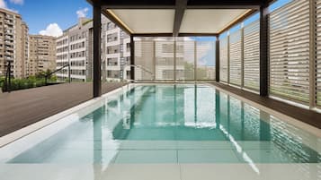 Seasonal outdoor pool, open 11:00 AM to 8:00 PM, pool umbrellas