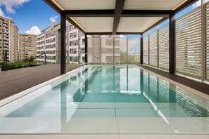 Seasonal outdoor pool, open 11:00 AM to 8:00 PM, pool umbrellas