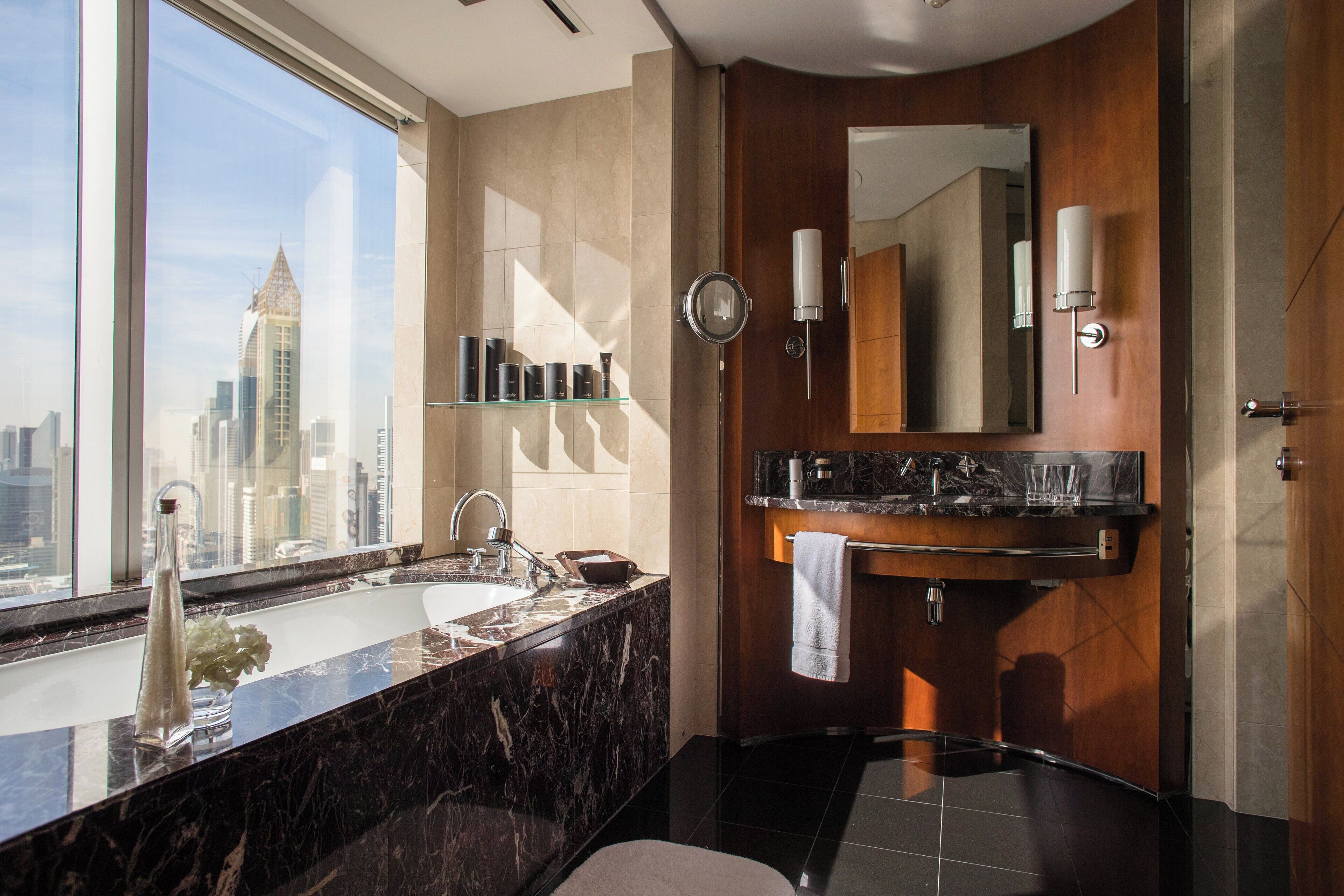 separate bathtub and shower, deep-soaking bathtub, designer toiletries