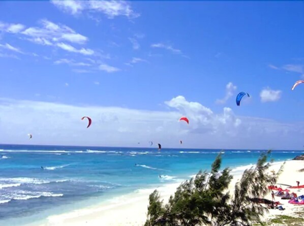 On the beach, white sand, free beach cabanas, sun-loungers