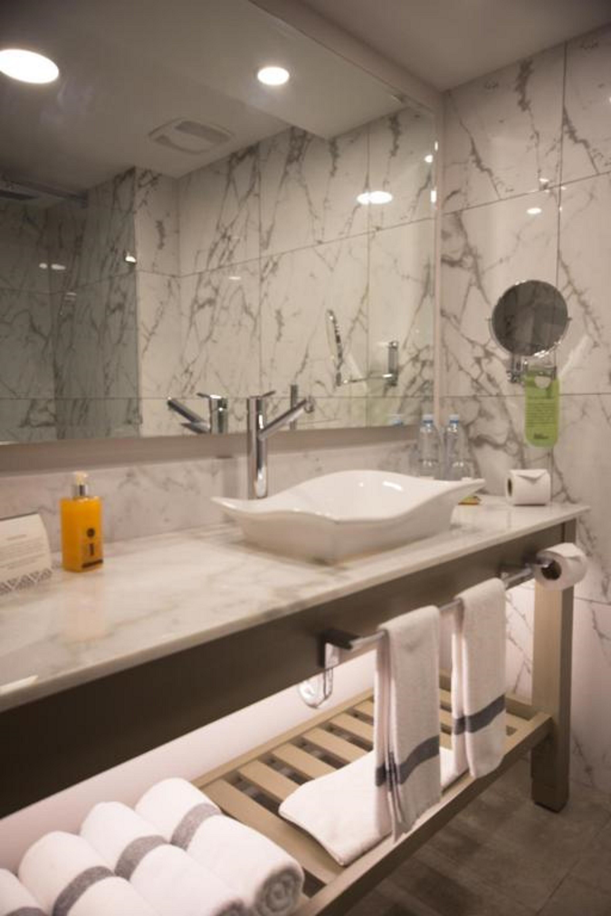 shower, rainfall showerhead, hair dryer, towels