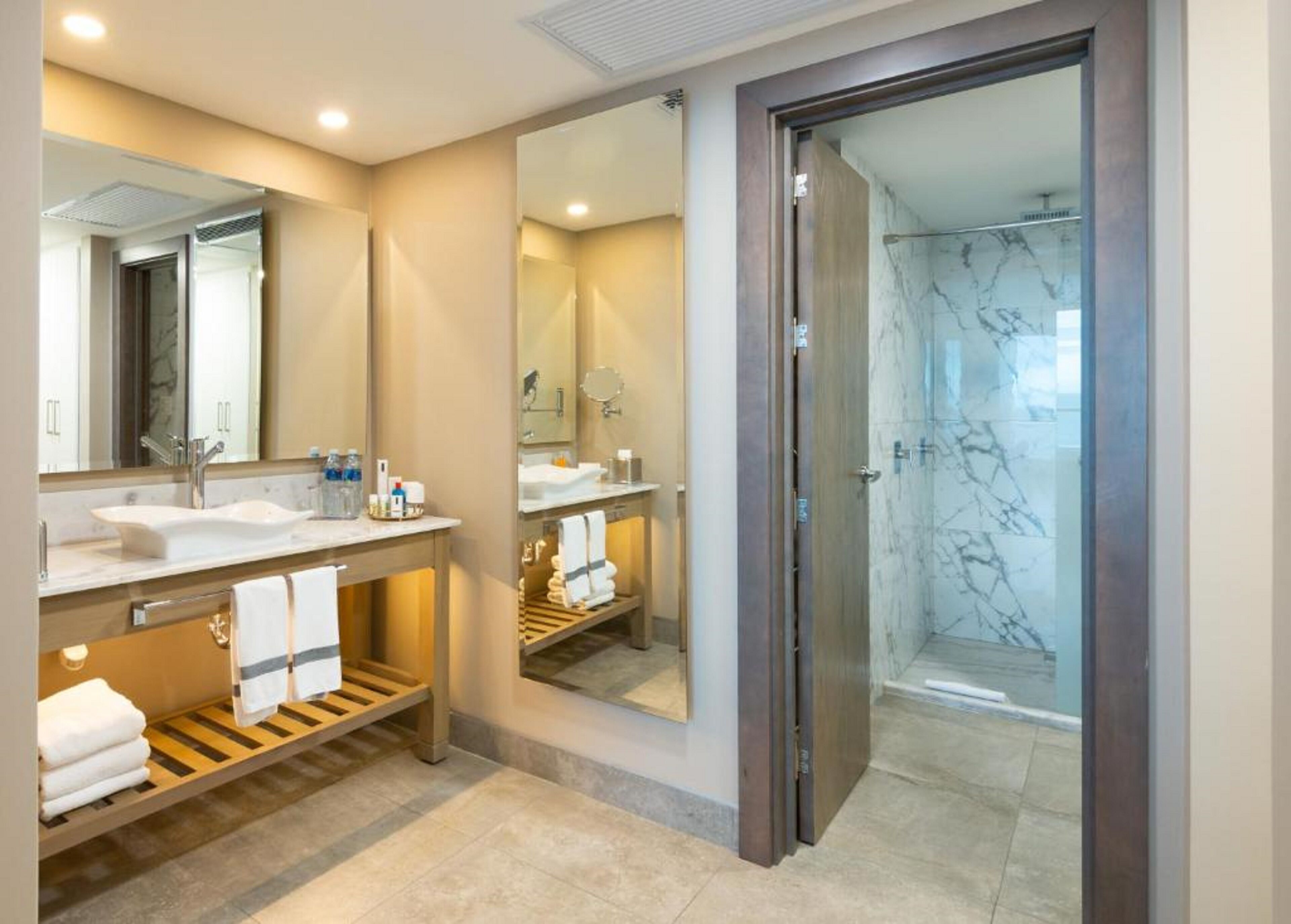presidential suite | bathroom | shower, rainfall showerhead, hair dryer, towels