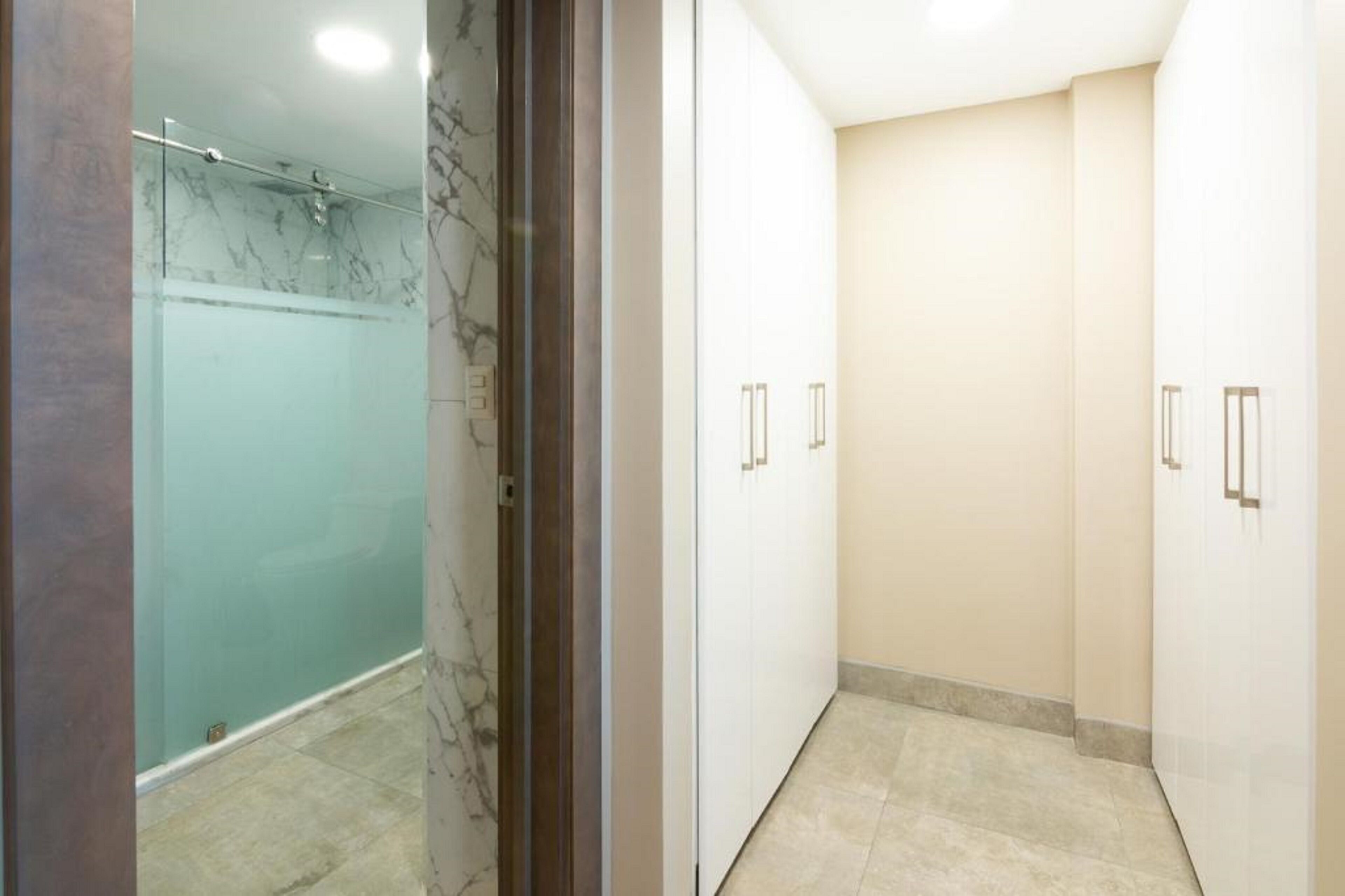 presidential suite | bathroom | shower, rainfall showerhead, hair dryer, towels