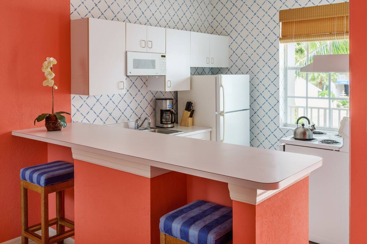 fridge, microwave, coffee/tea maker, cookware/dishes/utensils