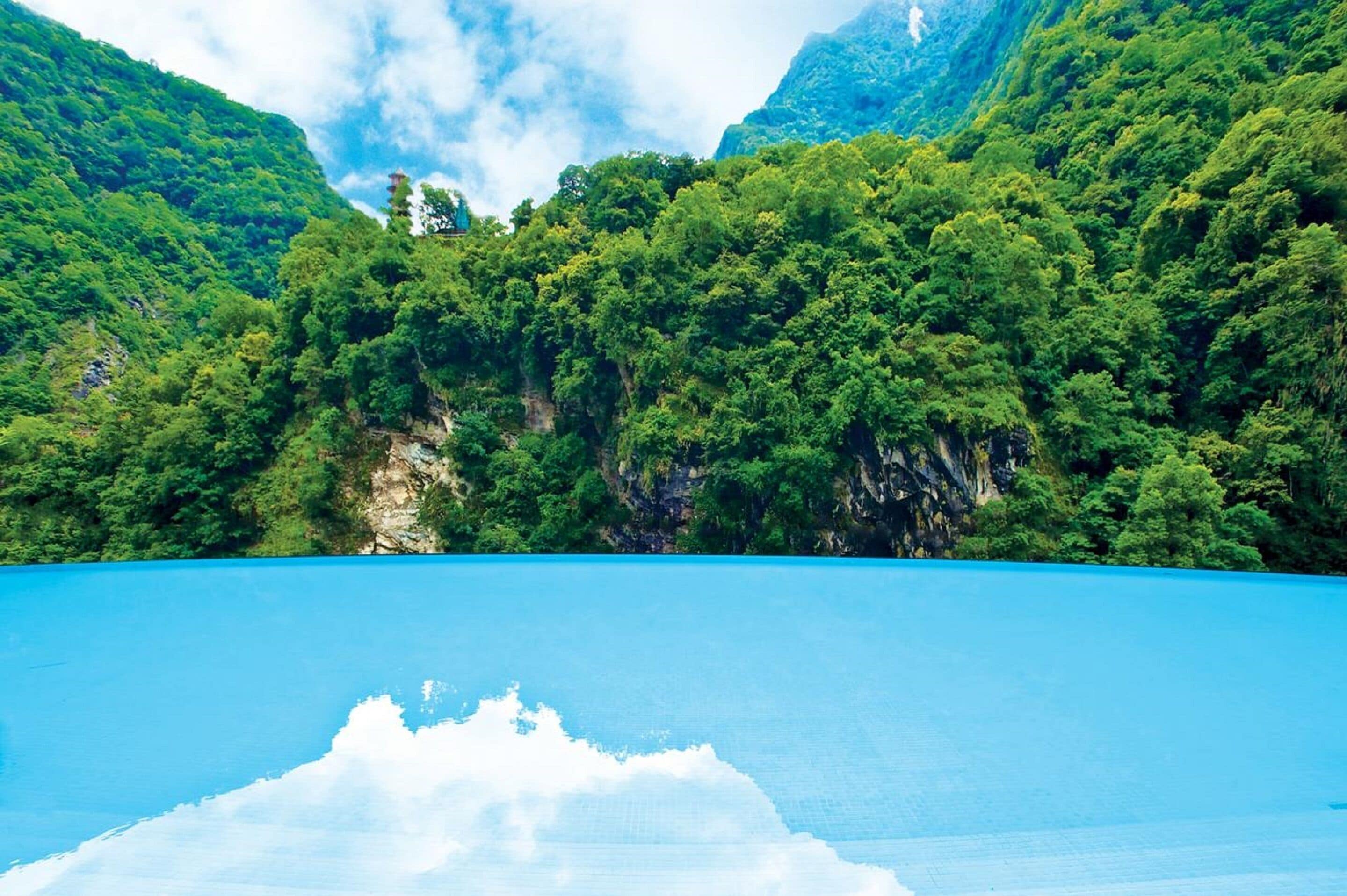 indoor pool, outdoor pool, pool loungers, lifeguards on site