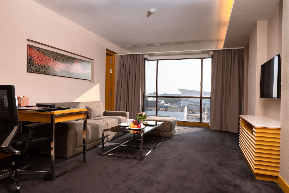 plaza suite | living area | 40-inch led tv with satellite channels, tv