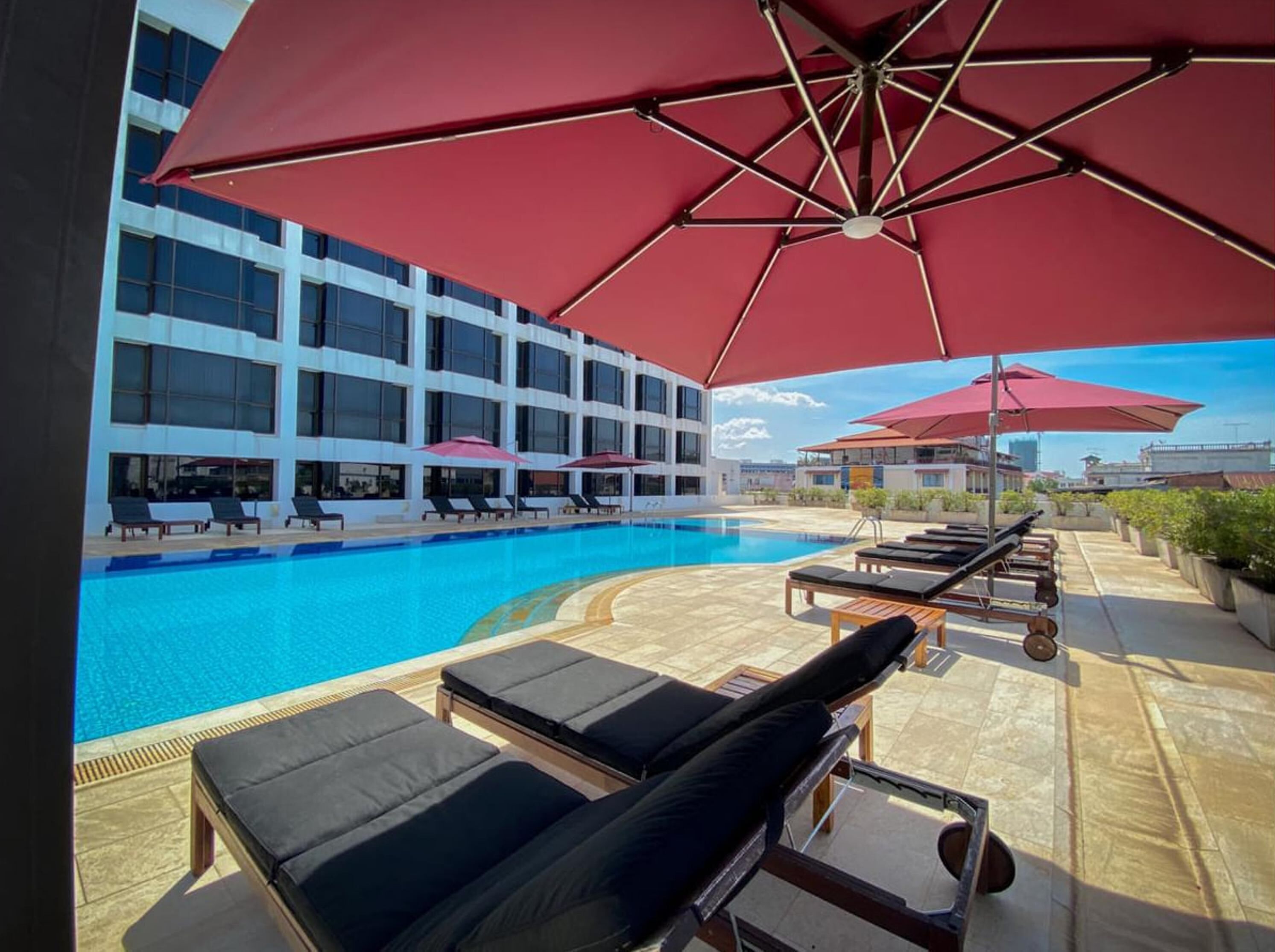 outdoor pool, pool umbrellas, pool loungers