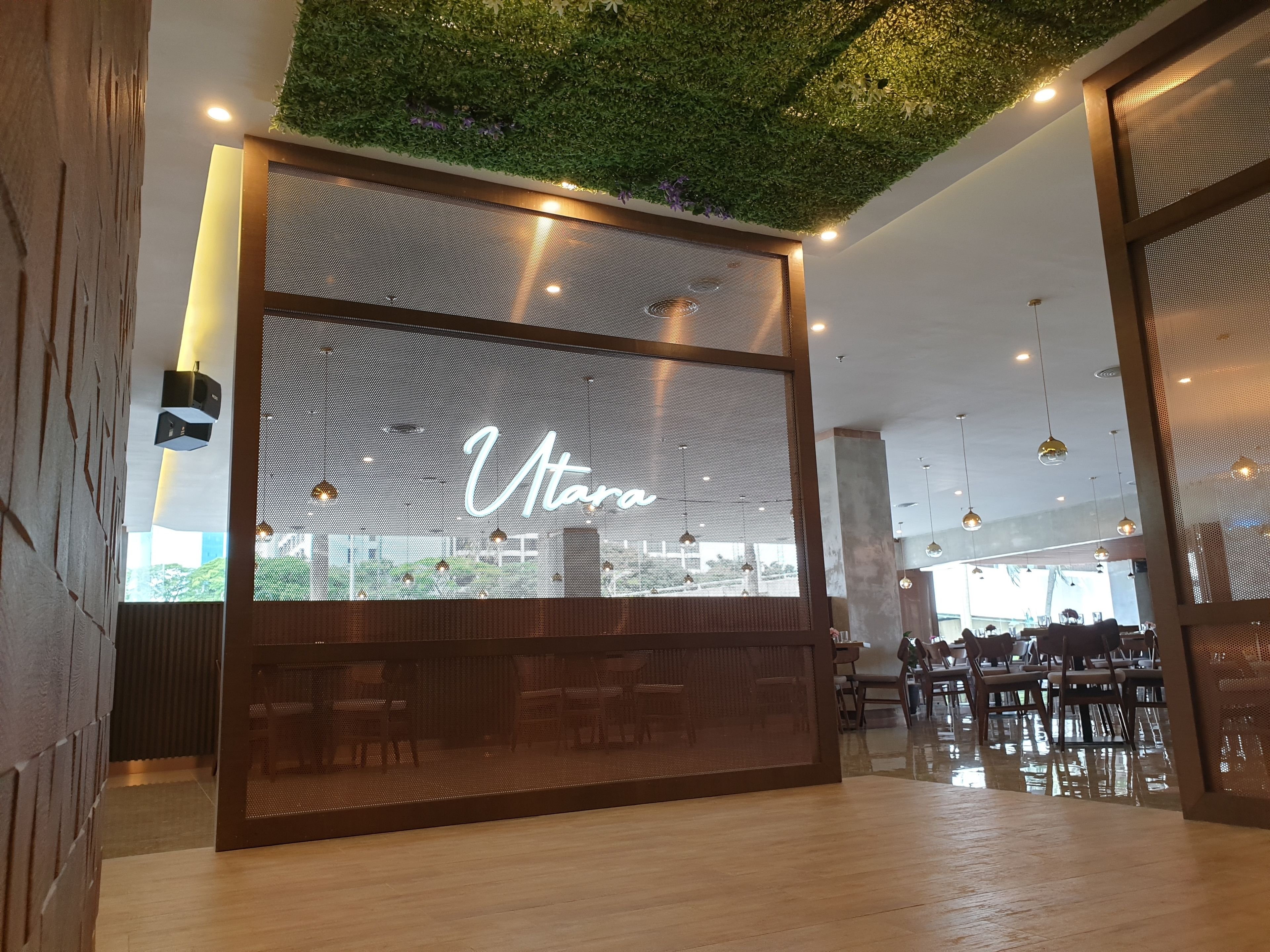 A modern interior with a large window displaying the name "Vtaro".