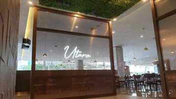 A modern interior with a large window displaying the name "Vtaro".