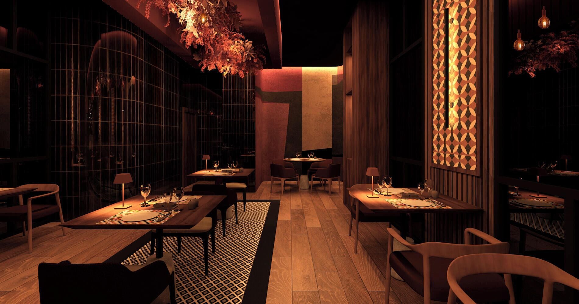 A dimly lit restaurant with tables set for dining, a patterned wall, and hanging light fixtures.