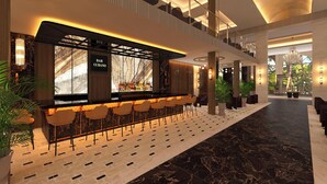 Un espace bar doté d’un comptoir en marbre, de tabourets de bar et d’une enseigne indiquant « BAR CUBANO ».