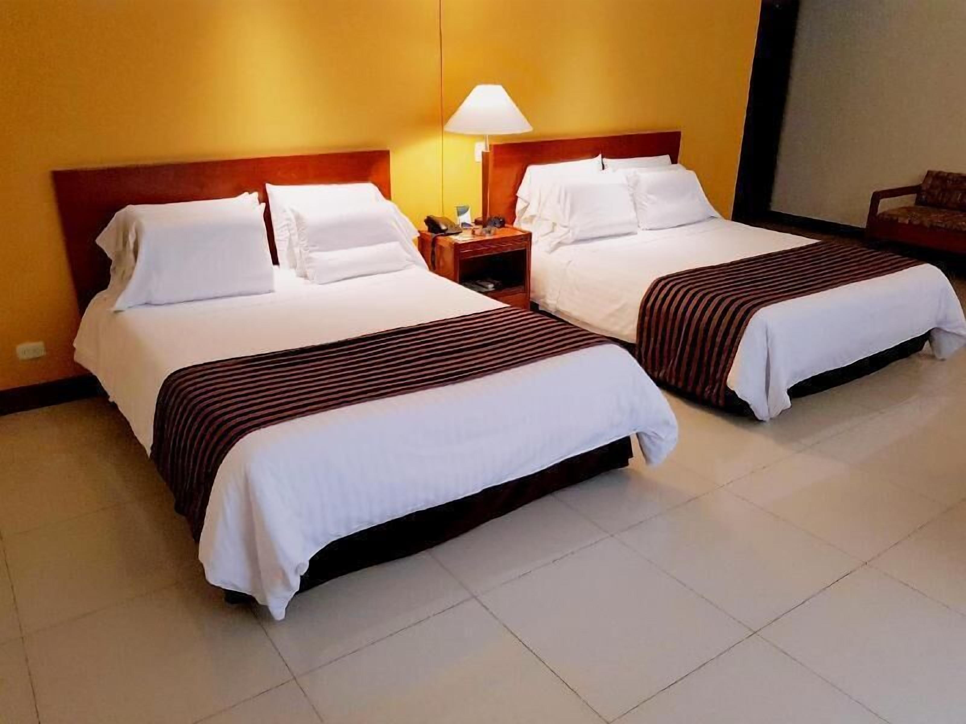 Hypo-allergenic bedding, pillow-top beds, in-room safe, desk