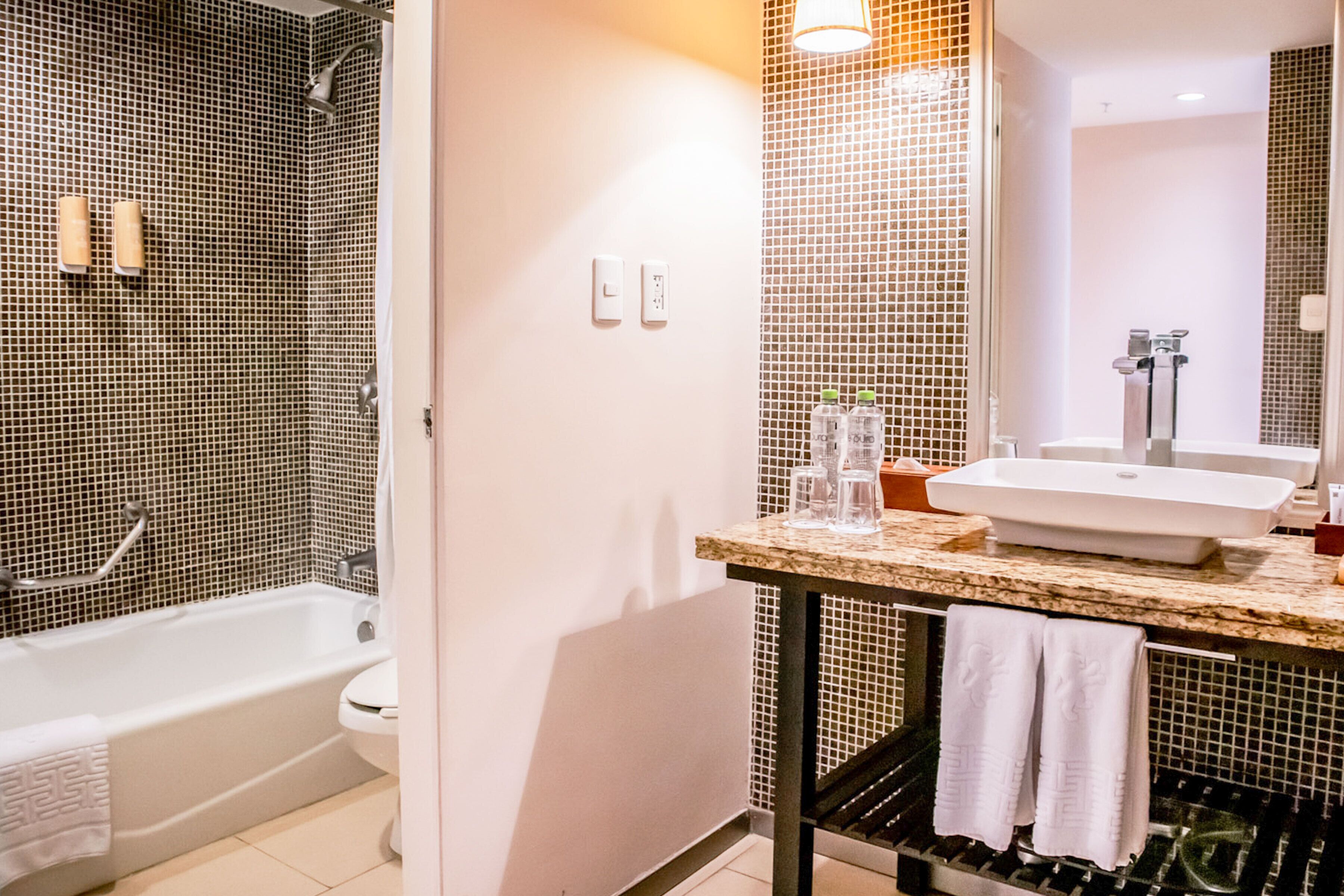 shower, hair dryer, bidet, towels