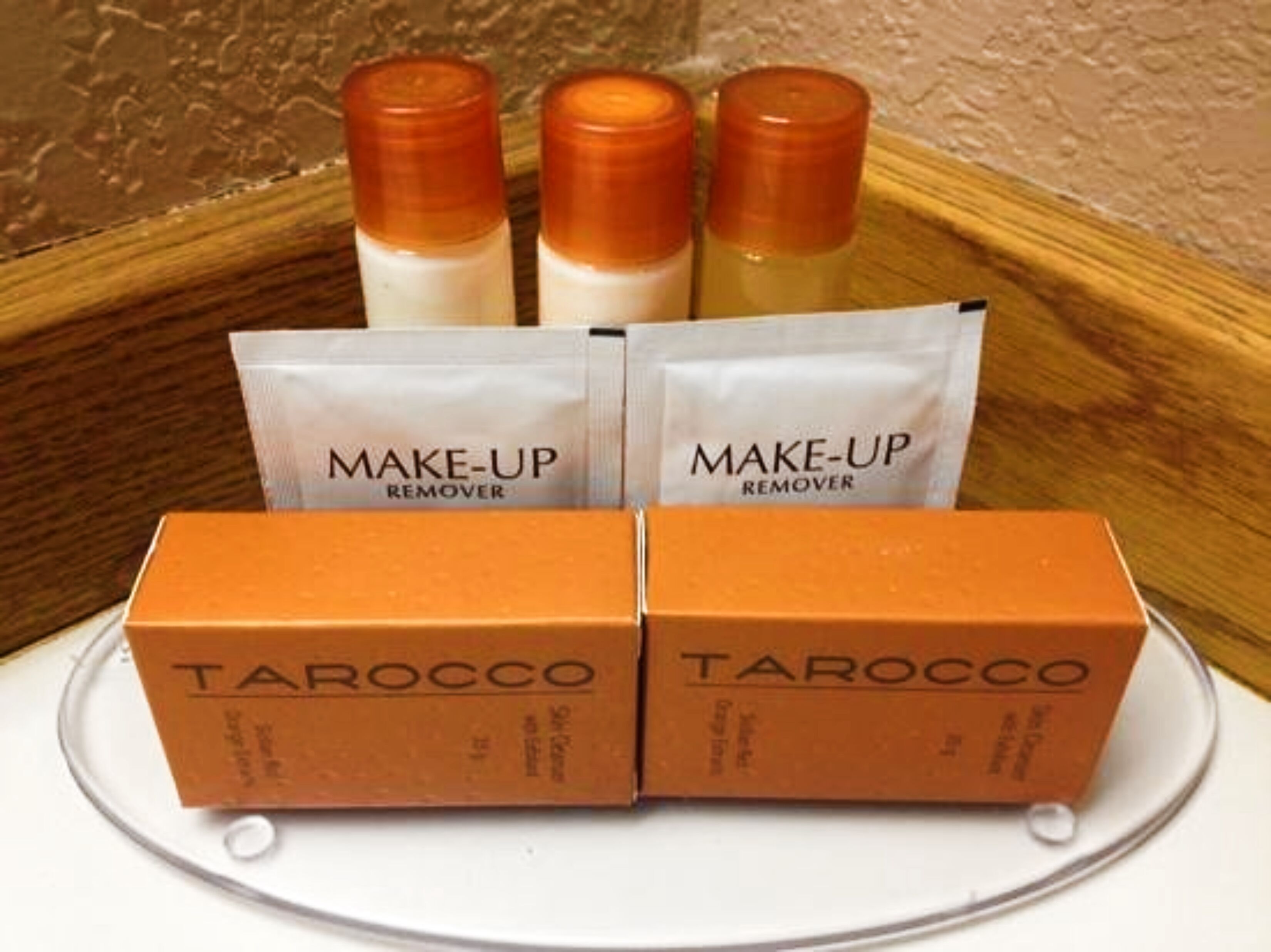 Four makeup remover bottles and two boxes of Tarocco makeup remover.