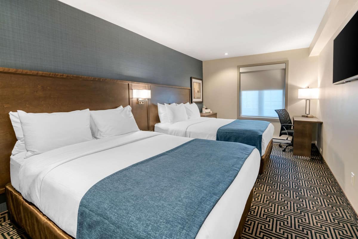 Standard Room, 2 Queen Beds, Non Smoking | In-room safe, desk, laptop workspace, blackout curtains