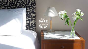 Premium bedding, down comforters, minibar, in-room safe