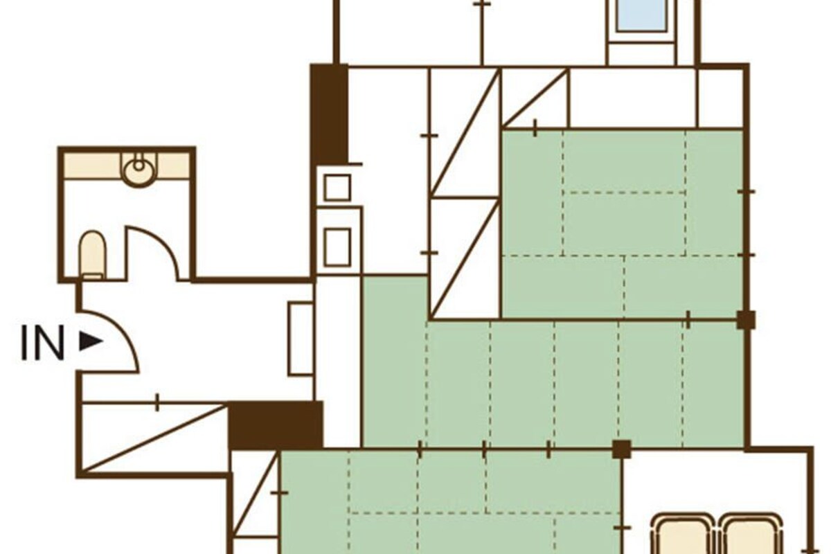 A floor plan with a kitchen, dining area, and two bedrooms.