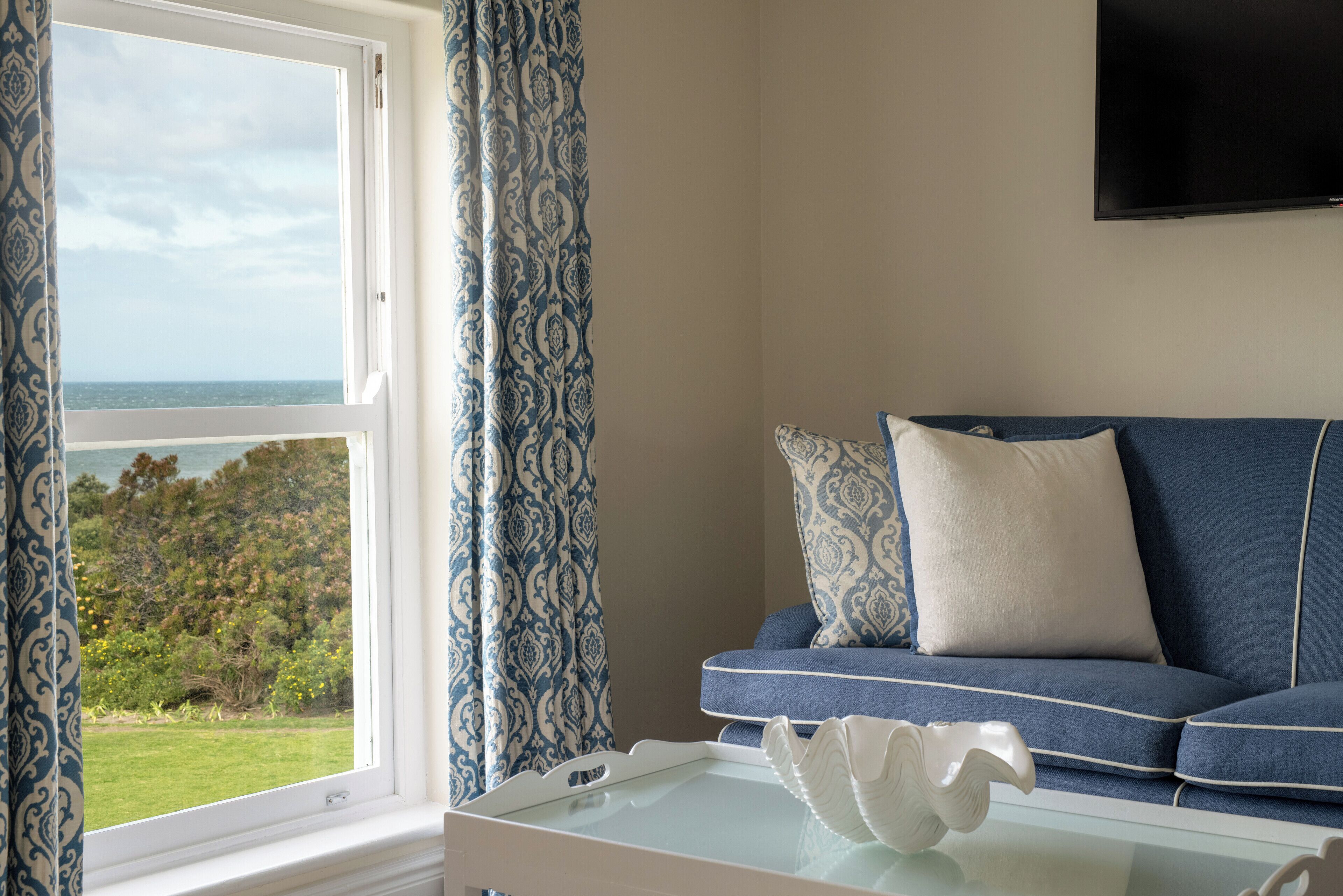 premier suite | living area | 43-inch smart tv with satellite channels, tv