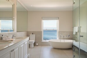 Premier Suite | Bathroom | Separate tub and shower, rainfall showerhead, free toiletries - The Marine Hermanus (Hermanus)