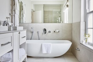 Separate tub and shower, rainfall showerhead, free toiletries