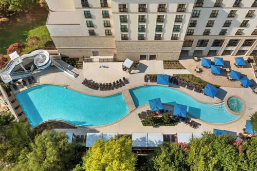 Outdoor pool, open 8:00 AM to 10:00 PM, cabanas (surcharge)